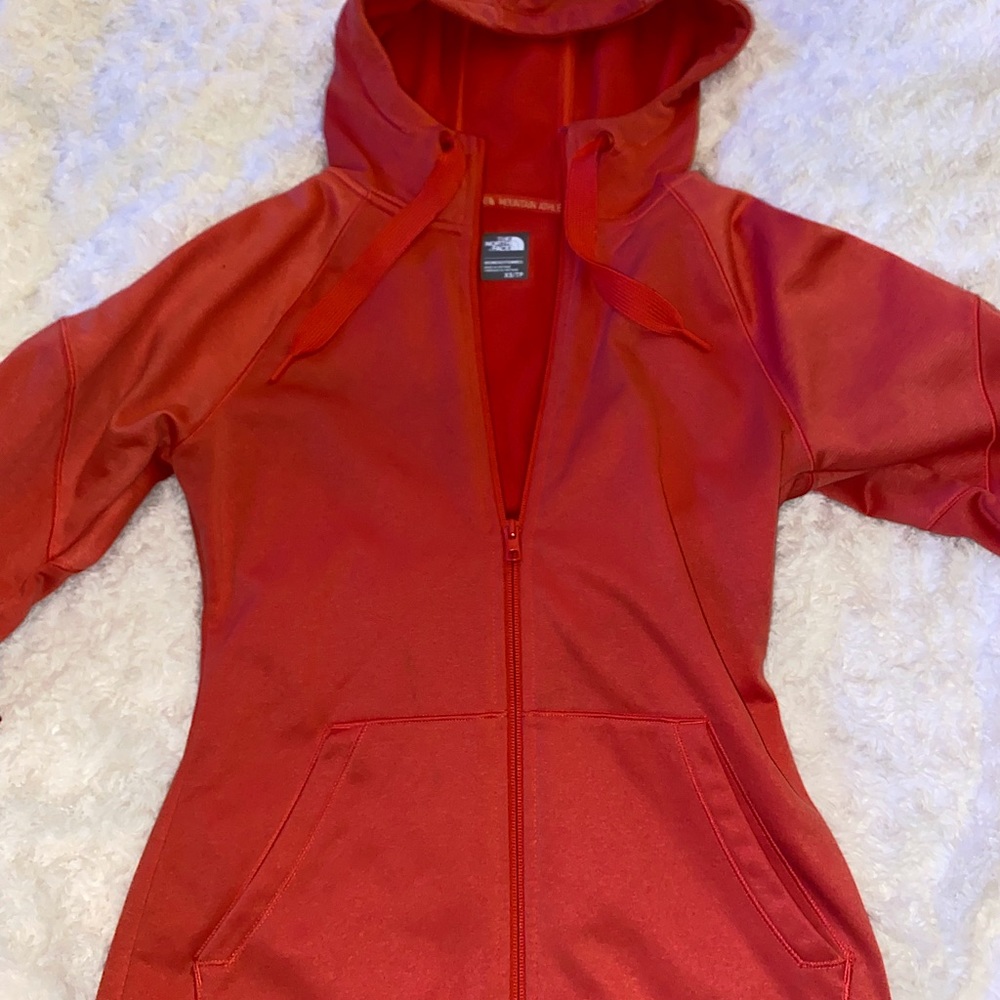 North Face zip up jacket.